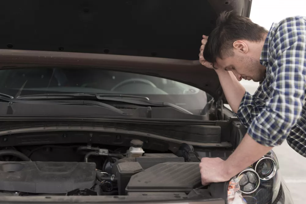 side-view-man-trying-repair-car