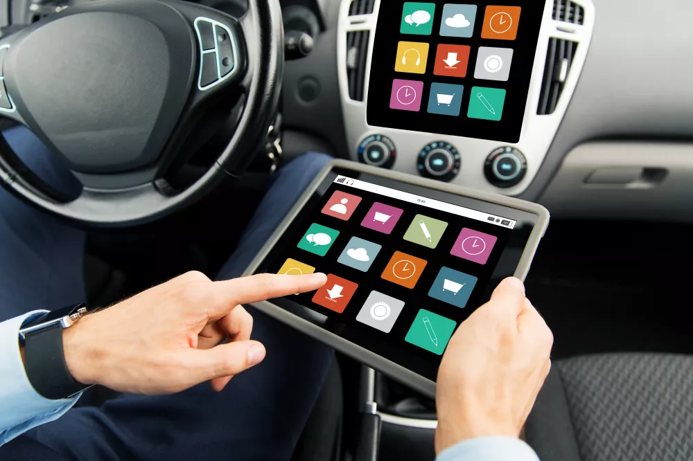 transport-business-trip-technology-media-people-concept-close-up-male-hands-holding-tablet-pc-computer-with-menu-icons-screen-car