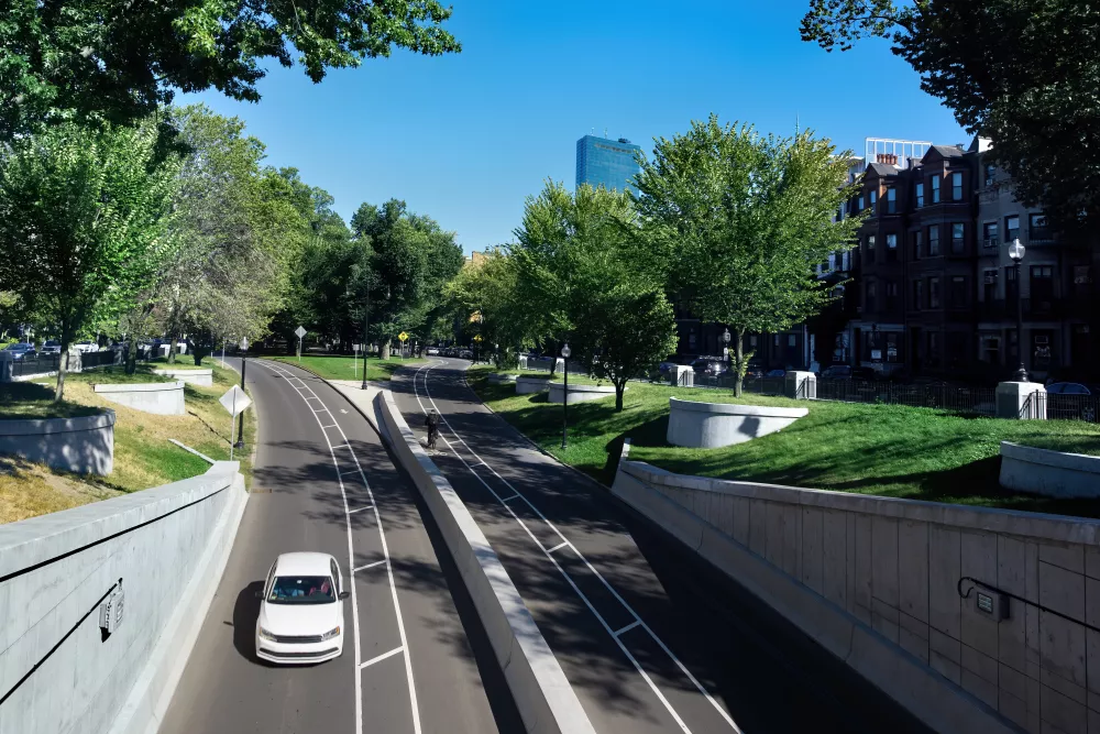 close-up-urban-road-with-car-greenery